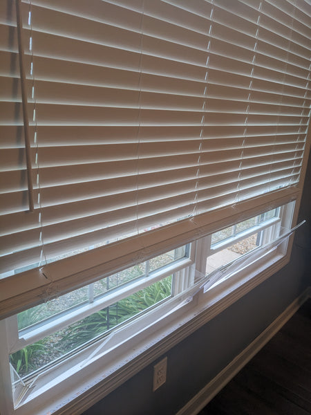 House window rain guard by Invisible Awning. Keep rain out while allowing fresh air in.