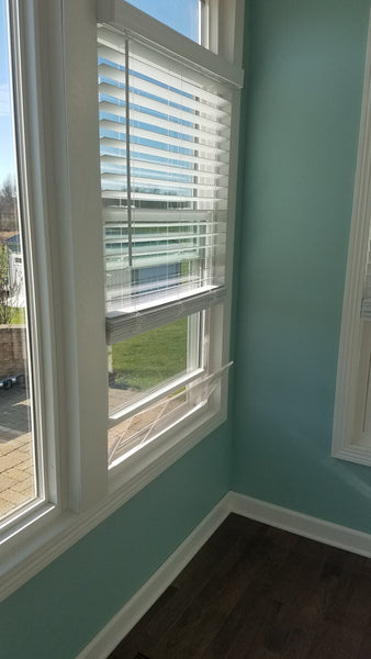House window rain guard by Invisible Awning. Keep rain out while allowing fresh air in.
