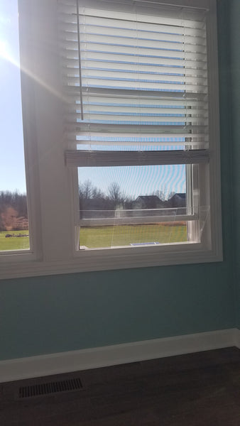 House window rain guard by Invisible Awning. Keep rain out while allowing fresh air in.
