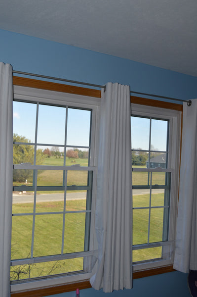 House window rain guard by Invisible Awning. Keep rain out while allowing fresh air in.